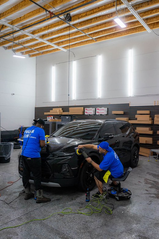 Vehicle paint being prepared for ceramic coating at Polar Tint