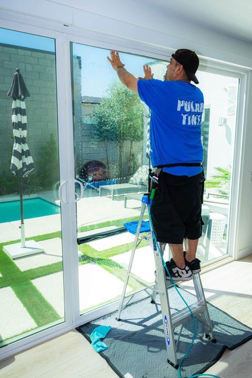 Window film being installed on a home window by Polar Tint